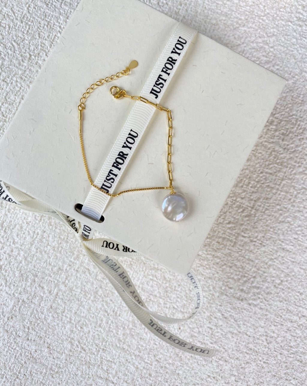 The Orbit Baroque Pearl Infinity Bracelet