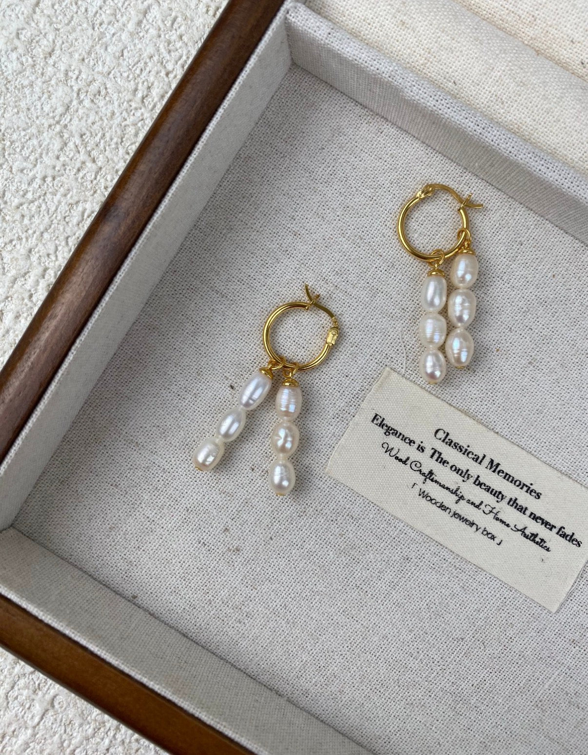 The Double Radiance Pearl Drop Earrings